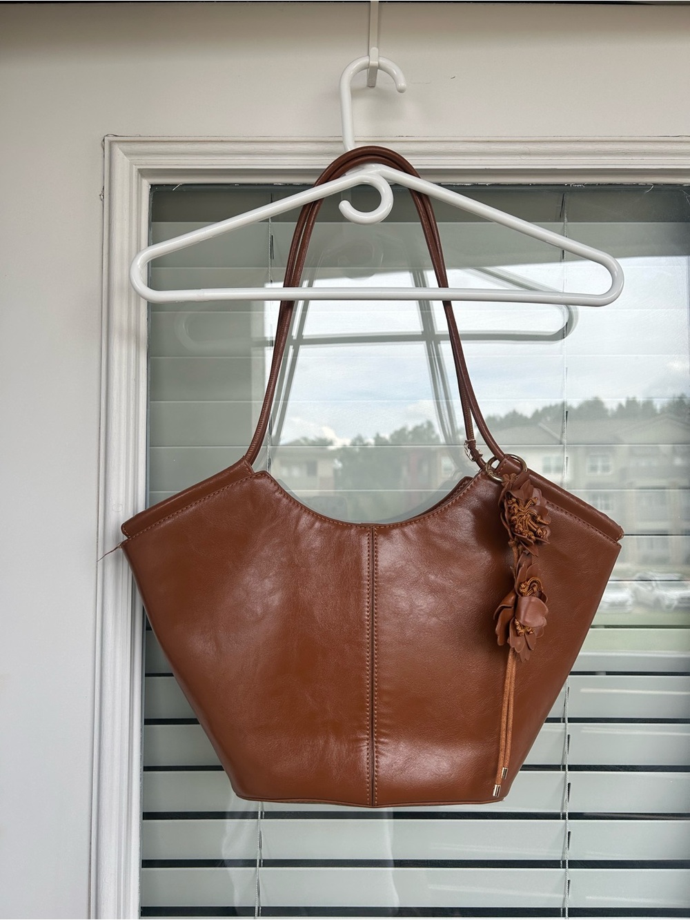 Classic Brown Leather Tote Handbag with Floral Charm